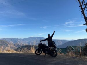 Ankit posing with the bike and Churdhar Mountains in Chail