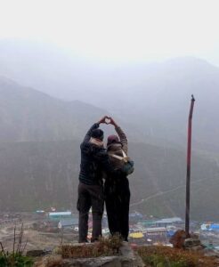 Couple posing for a shot just on the side mountain (near Modi gufa) of Kedar Nath